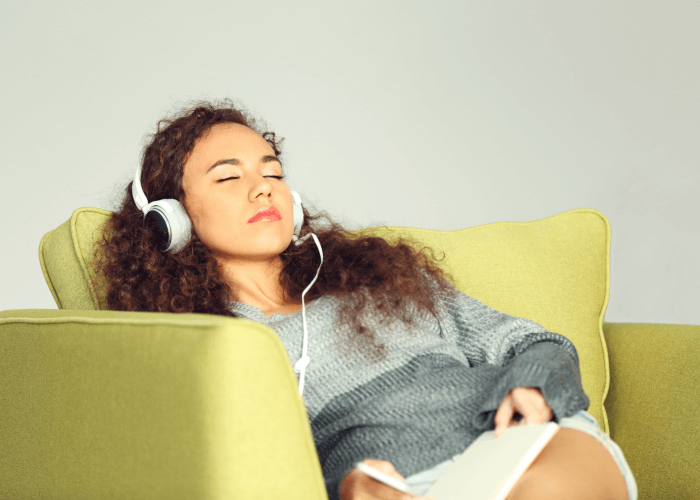 woman going to sleep while listening to music