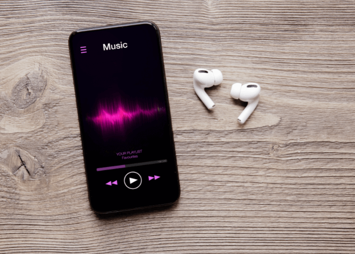 smartphone playing music on earbuds