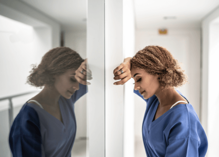 girl leaning infront of a window